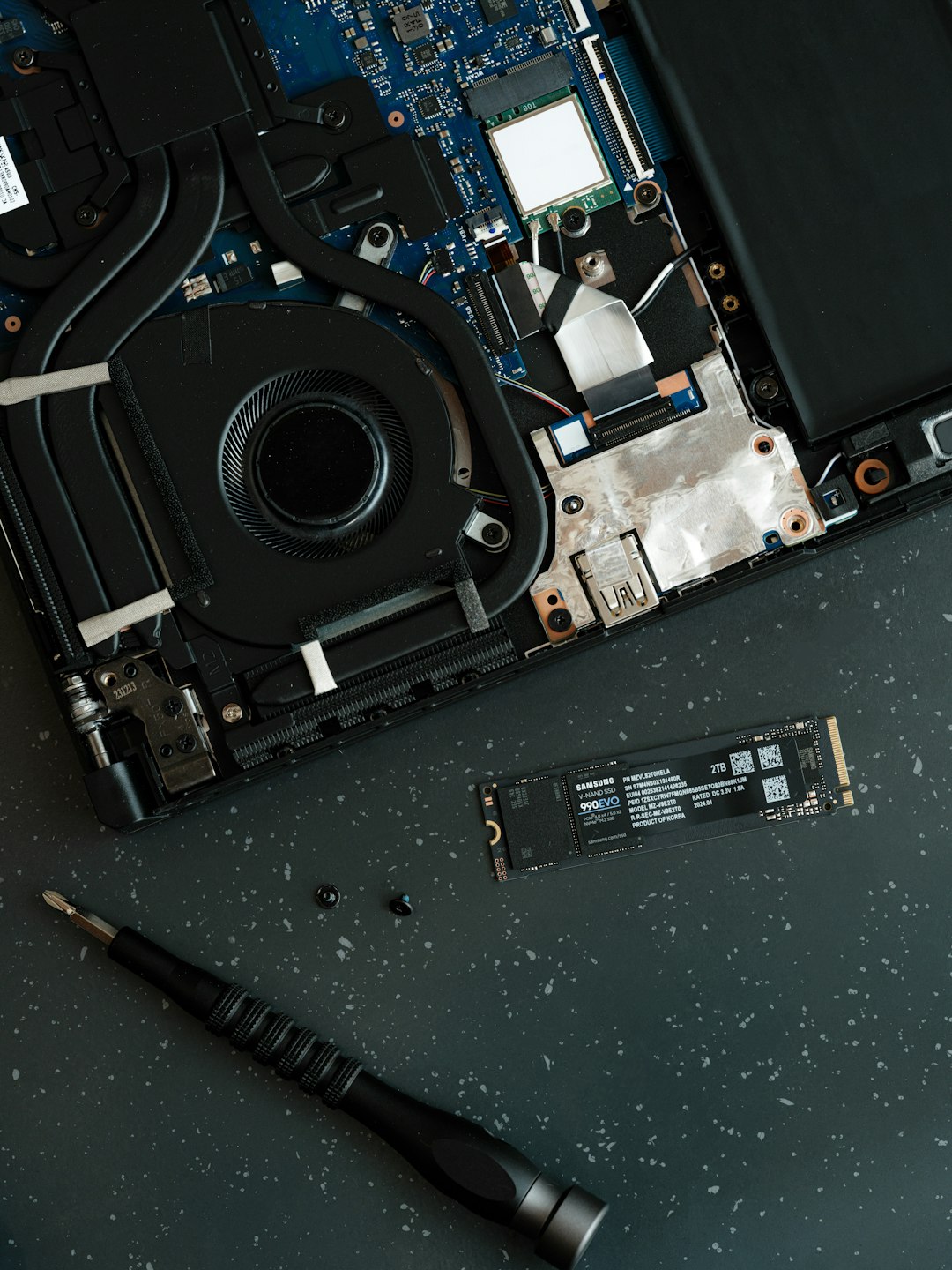 the-motherboard-of-a-laptop-with-a-screw-in-it-qtw80j6zk4c